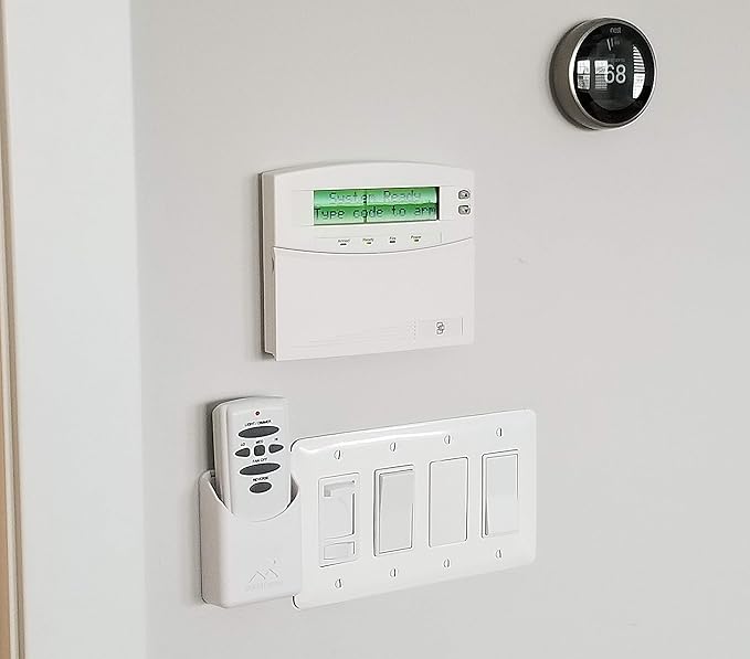 The No-Screwups Remote Control Holder by Mount Genie (Black): Wall Mount with No Damaging Screws or Tape. Installs in Seconds on Any Light Switch. Great for TV, Ceiling Fan and Roku Remotes.